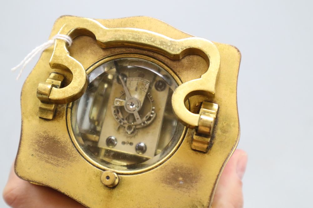 A brass cased carriage clock, height 14cm with handle down